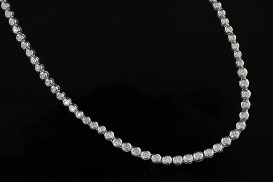 A modern Italian 18ct white gold and graduated diamond spectacle necklace, 41.5cm.